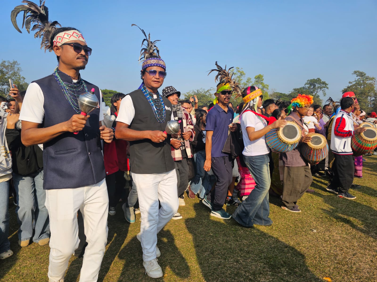 A massive celebration marked the Garo New Year 2026, bringing together thousands of people from across India and even international visitors to the Bangsi Apal playground in North Garo Hills. The festival showcased the rich cultural heritage of the Garo community and was especially notable for its vibrant drumming and traditional dances.  The festivities began early in the morning around 9 AM, as the first beats of the drums echoed through the area, drawing crowds eager to join the celebration. Women, taking center stage, played powerful drum rhythms that energized the participants. Men, women, and young people danced together to the pulsating beats, creating a lively and colorful atmosphere.  By noon, hundreds of thousands of people were seen dancing and celebrating in unison, marking one of the largest gatherings for the Garo New Year in recent years. The event not only highlighted the community’s artistic traditions but also reinforced unity, joy, and cultural pride among participants.  Organizers said the festival aims to preserve tribal customs while providing a platform for cultural exchange, as many visitors from outside the region attended and participated. The 2026 celebration of the Garo New Year was hailed as a grand success, leaving lasting memories for all who attended.