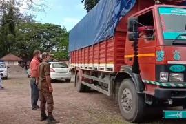 Truck full of liquor in police net, where was the cartoon liquor brought from?